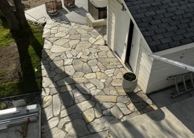 Emerald Irrigation flagstone walkway near lake